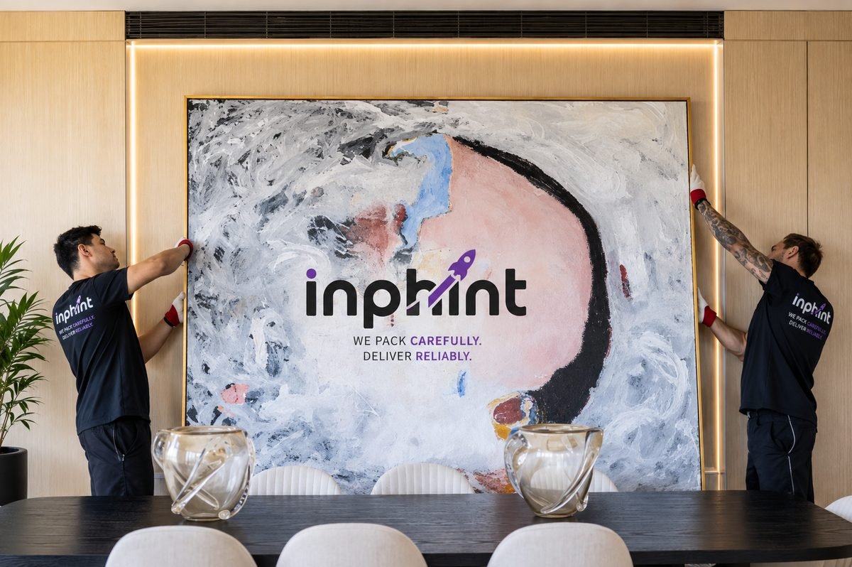 Fine furniture removals — crew hanging artwork